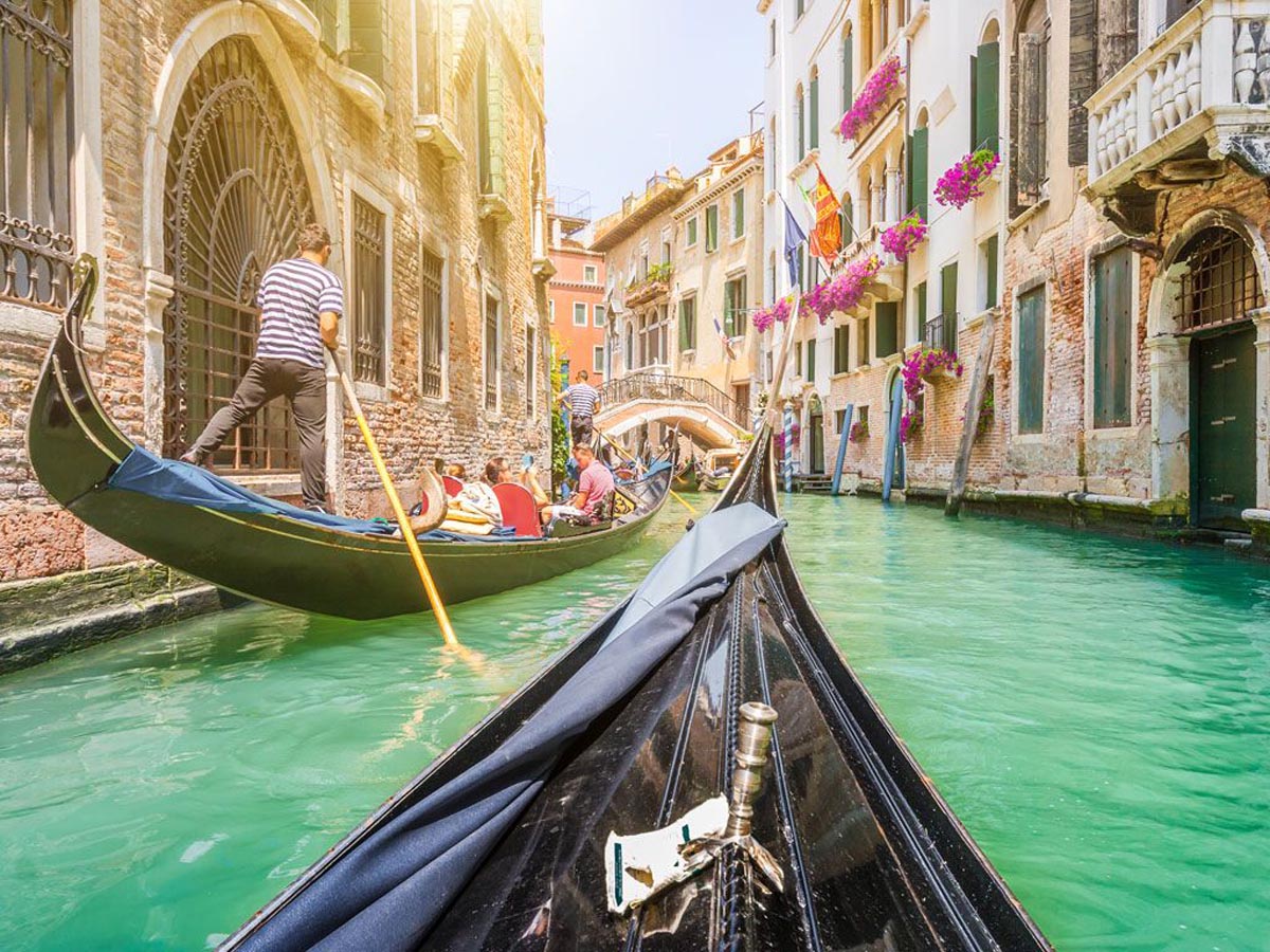 Enjoy romantic gondola rides through the canals of Venice.